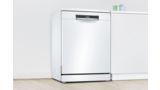 Freestanding white Bosch dishwasher in a white kitchen.