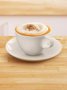 Coffee cup filled with cappuchino.