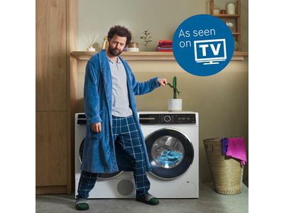 Bosch freestanding washer next to condense dryer in a modern laundry room.