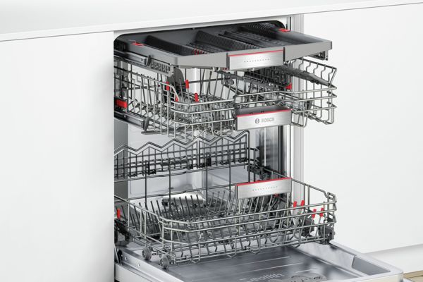 Open Bosch dishwasher shows three rack system for dishes, pots and cutlery.