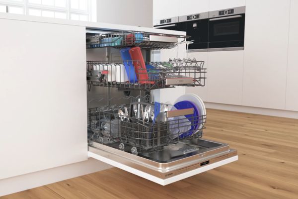 Full Bosch PerfectDry dishwasher with door open and three racks pulled out.