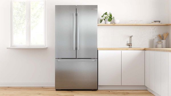 French door fridge in an open kitchen.