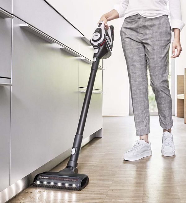 Person using cordless vacuum cleaner
