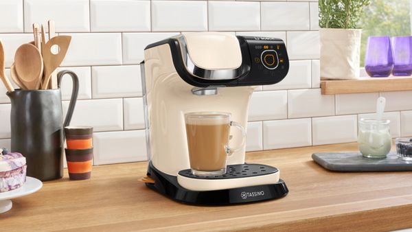 TASSIMO MYWAY in the colour beige brewing a coffee on a kitchen worktop .