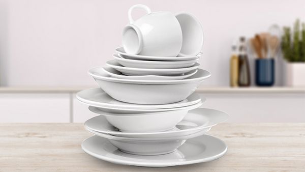 A stack of white clean dishes.