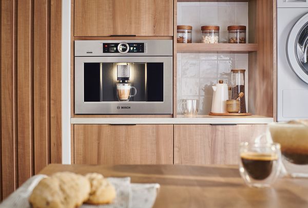 Bosch built-in coffee machine, front view in a modern kitchen. 