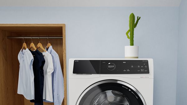 a washing machine by a closet