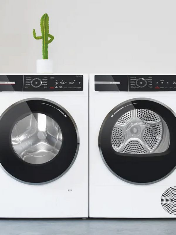A washing machine and tumble dryer next to each other